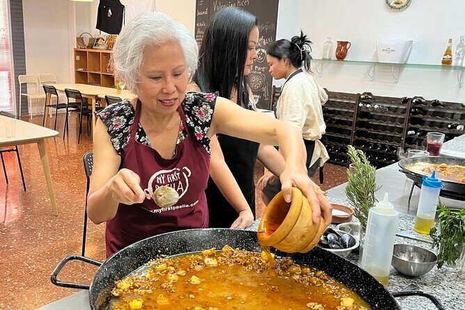 Seafood paella cooking class, tapas and visit to Ruzafa market. - Cooking seafood paella: hands-on roles, clear step-by-step guidance